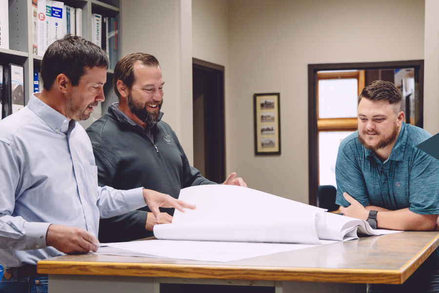 Vemco team members talking in Billings office space